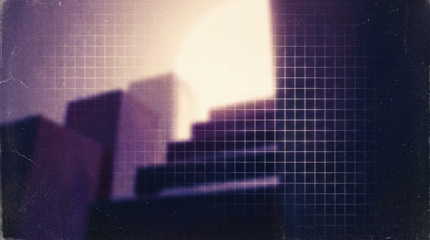 Three people sitting on a couch in a room looking at mobile devices