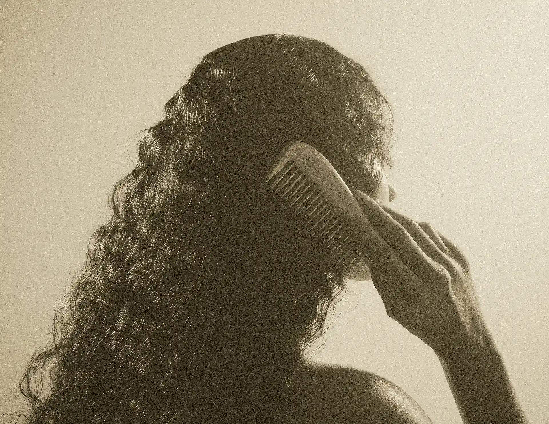 Lifestyle photography for Novarae haircare brand showing branded comb in use