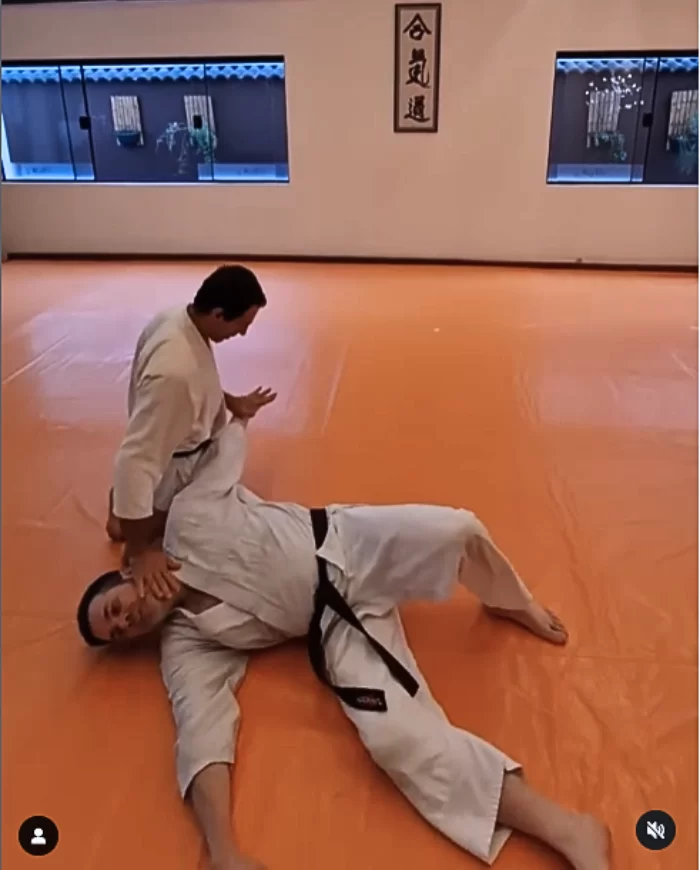 Two MMA students practicing striking during a training session.
