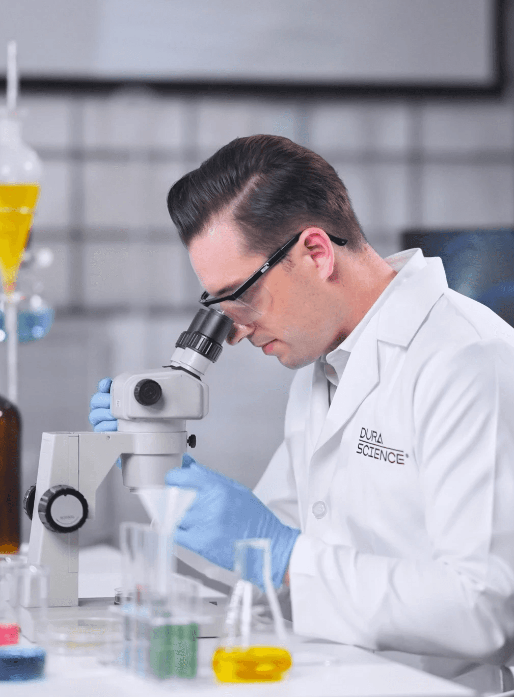 Portrait of a person in dark clothing speaking on a phone