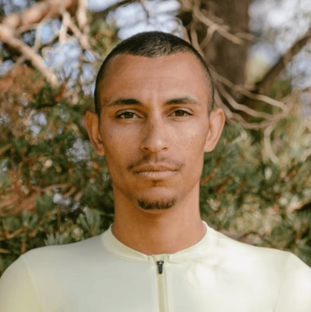 A person in a blacl coat and the brown hairs