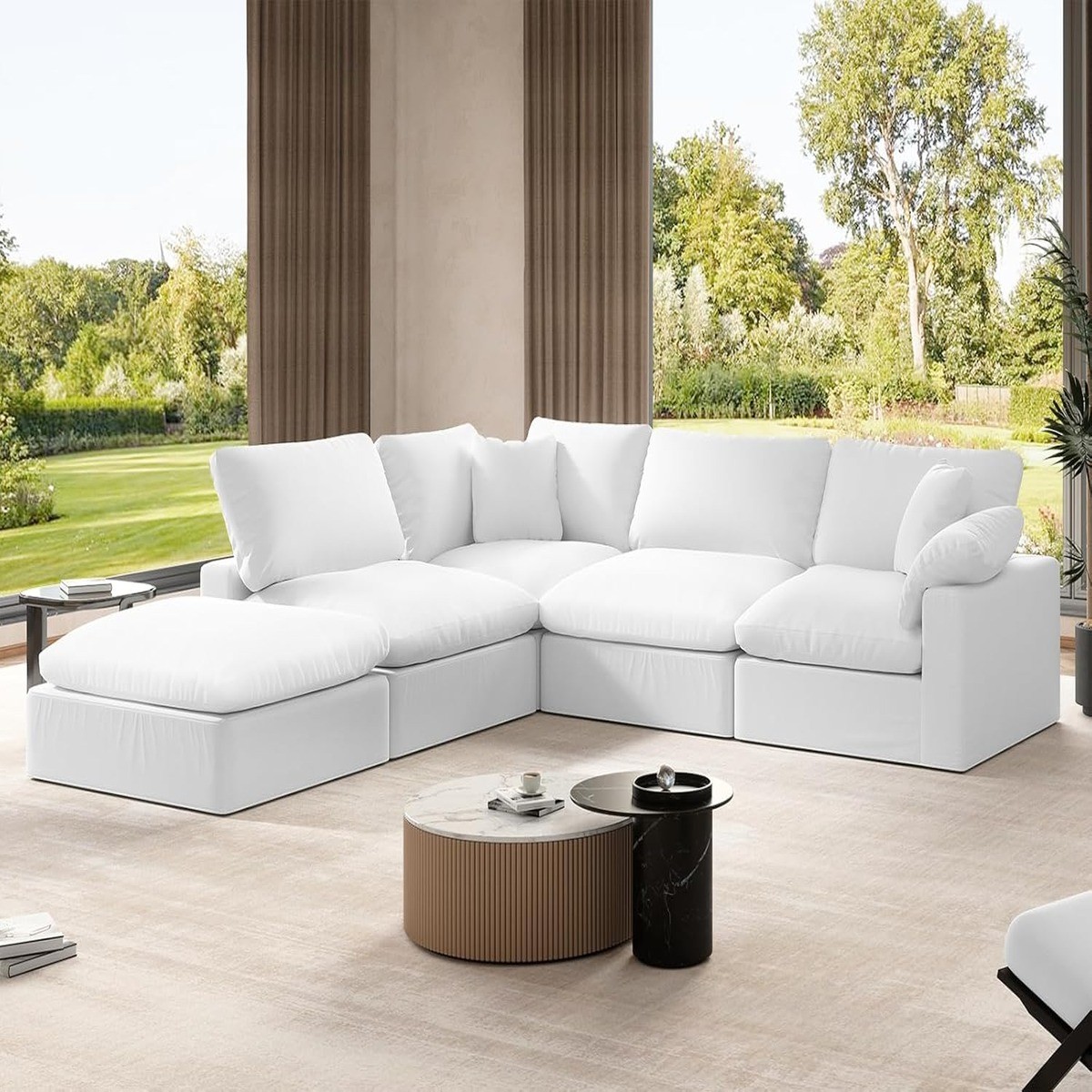 Oversized Sectional Cloud Couch in a spacious, open living area with floor-to-ceiling windows and neutral decor