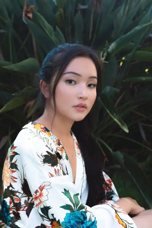 A woman smiling with her arms crossed