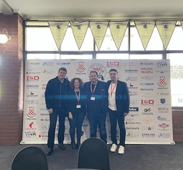 Club members celebrating an award for North Geelong Warriors.