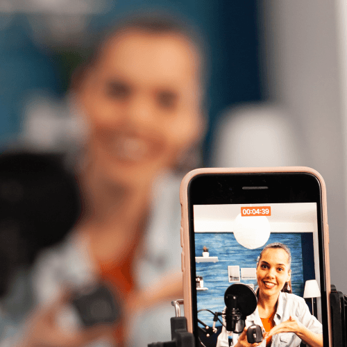 woman in white tank top and blue denim jeans sitting on yellow sofa