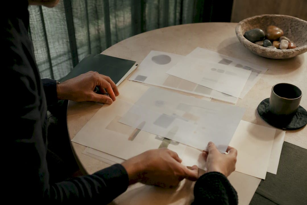 Hands generating marketing budget scenarios