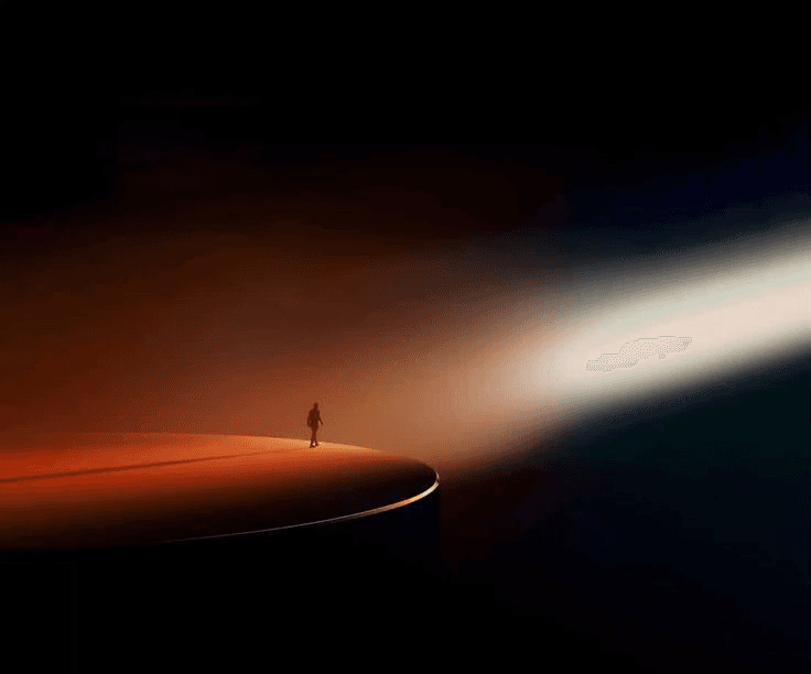 Image of a person sitting in the green fields