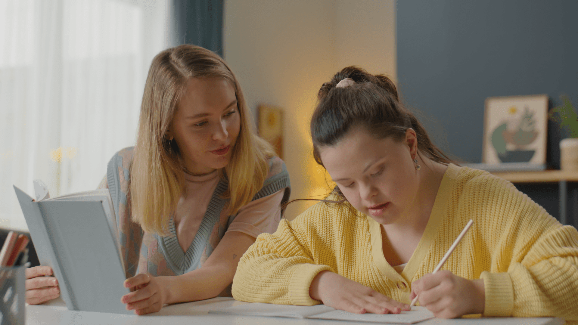 Two women working together.
