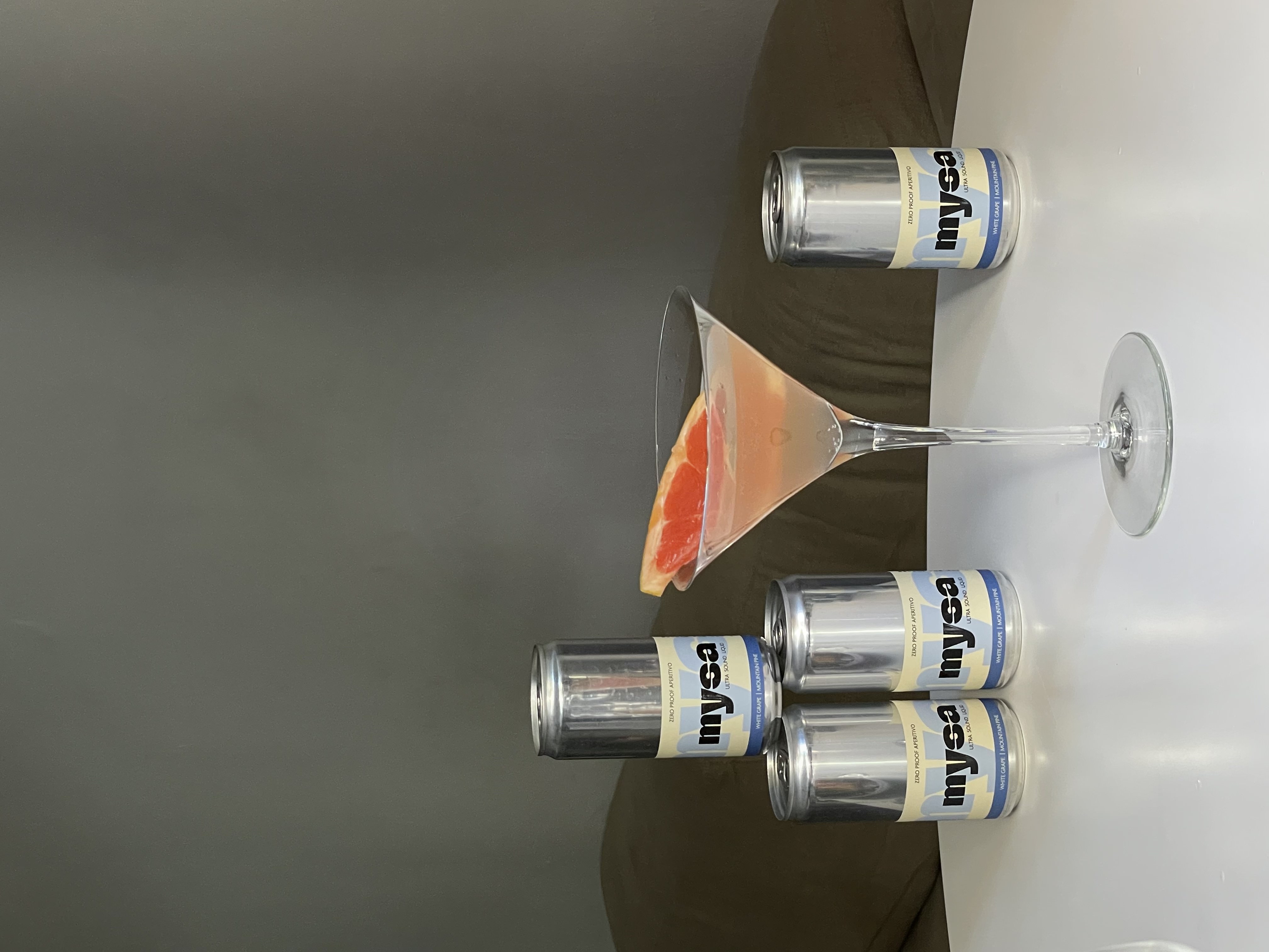 close-up of mysa served in a crystal coupe glass with a chili and square ice cube