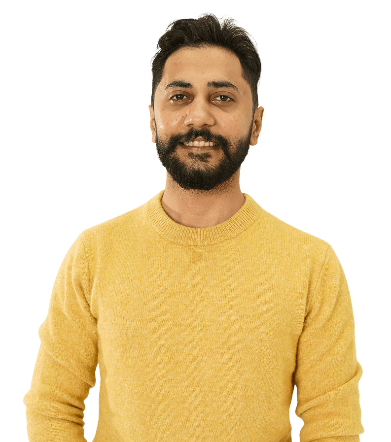 Smiling man in glasses holding a tablet.