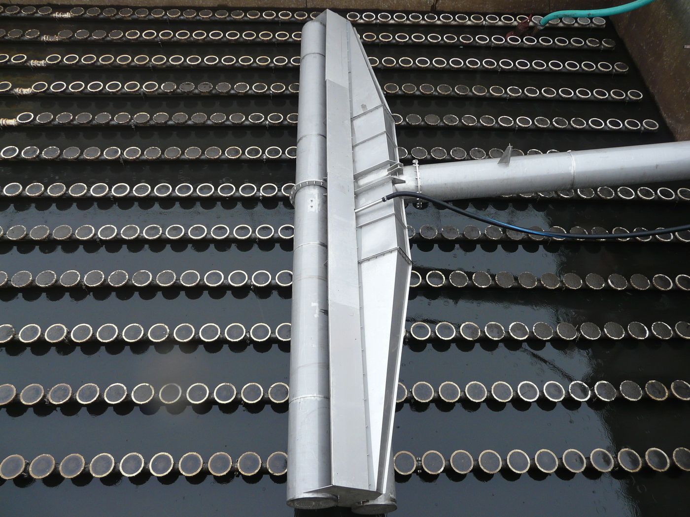 BIODEC decanter arm above the aeration diffusers in an empty SBR basin at Makó, Hungary