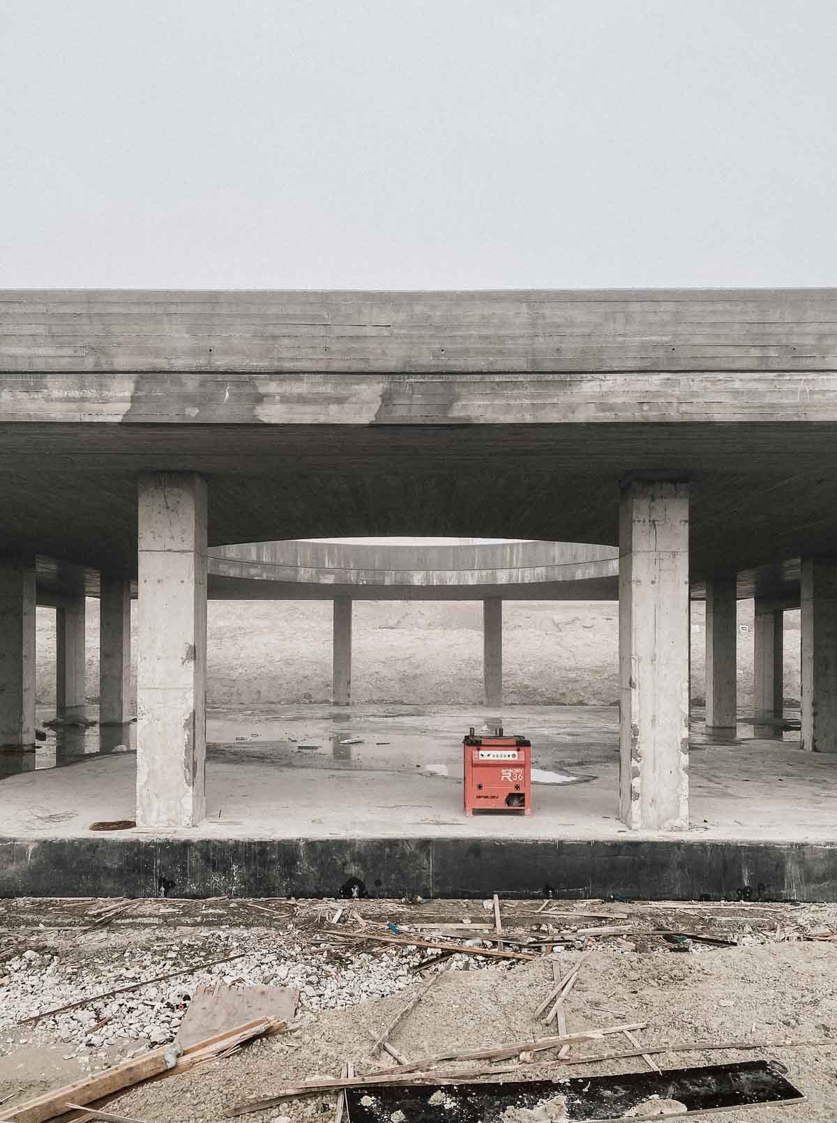 A fast black sports car races down the highway.