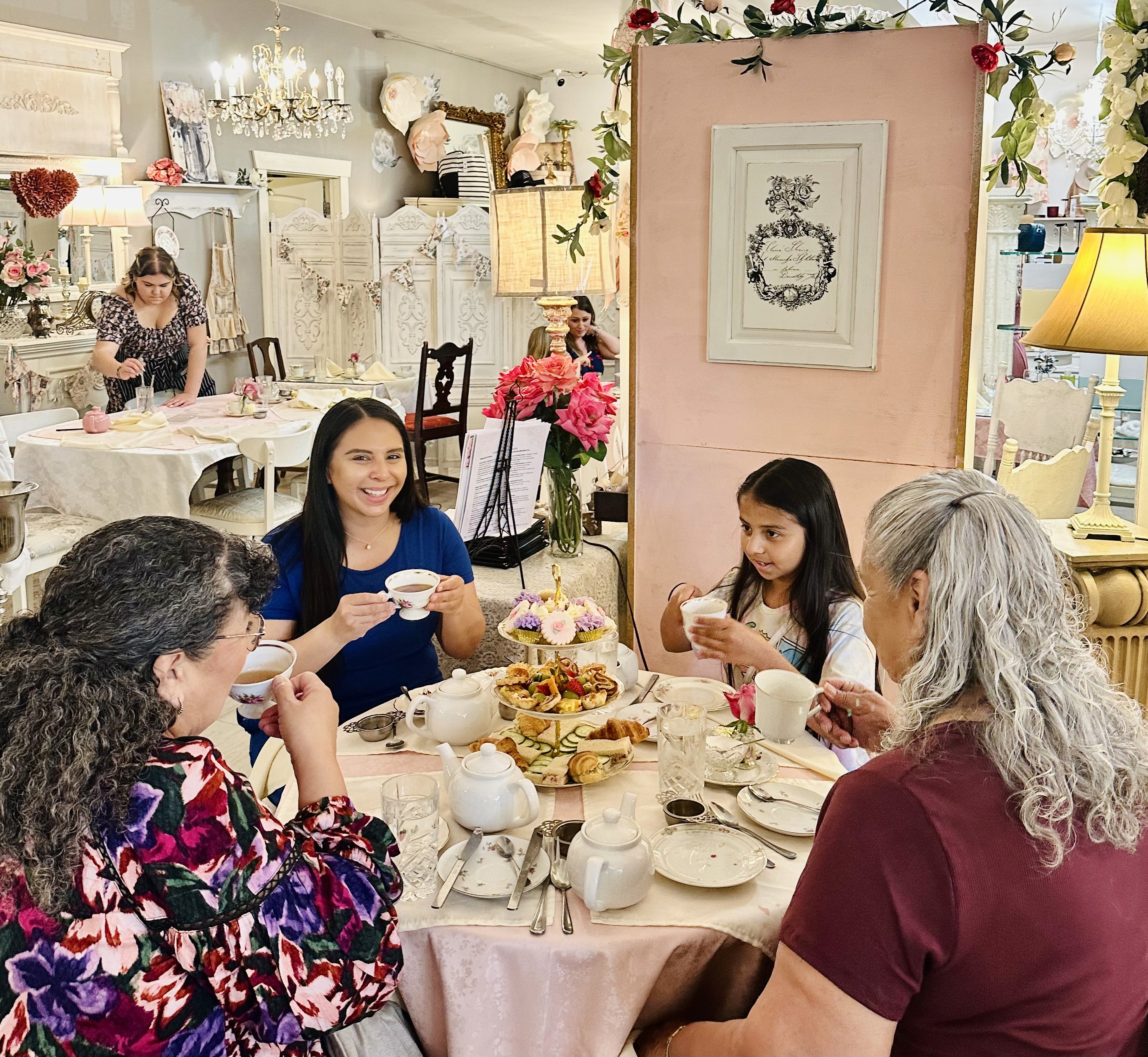 a family of four enjoying excellent tea service in a beautiful tea room