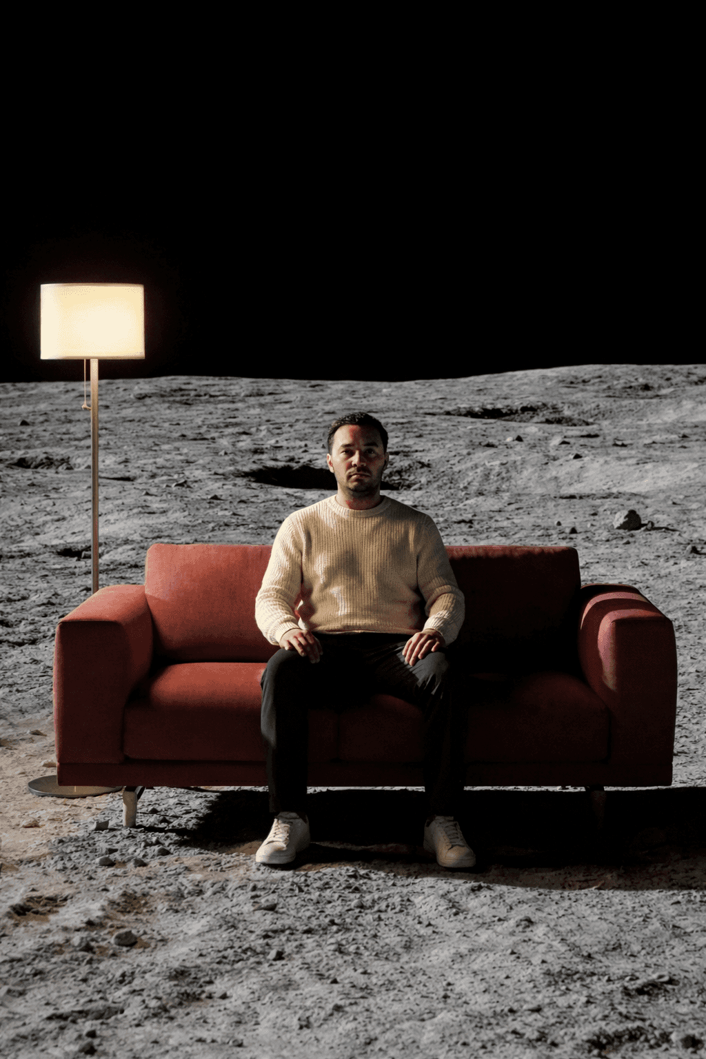 a blurry photo of a person standing in front of a wall