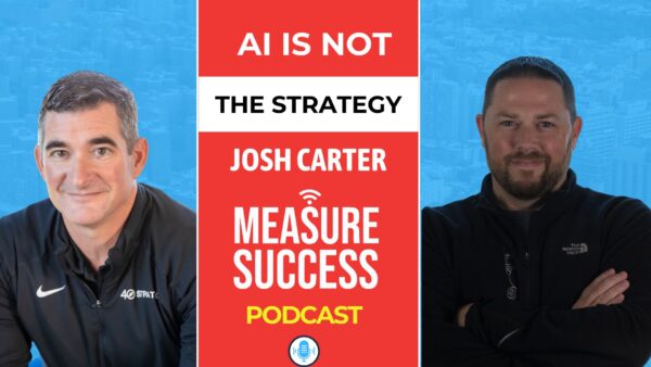 Abstract painting of arched layers in warm shades of orange, red, and yellow with a green center.