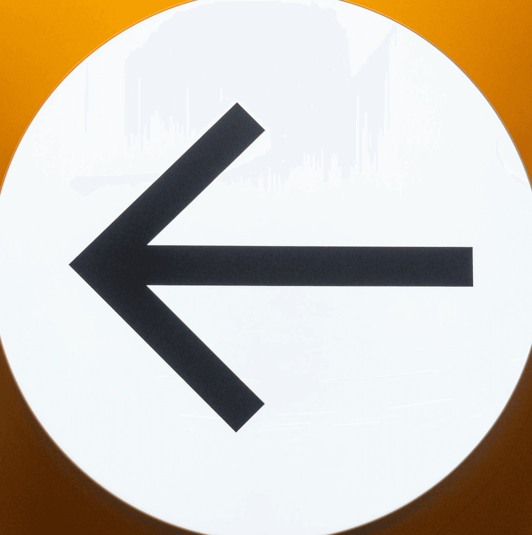 a round sign with an arrow pointing to the left