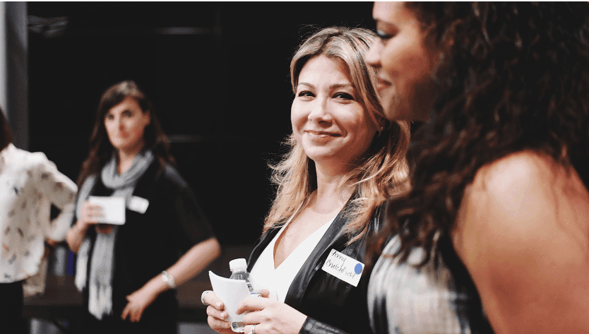 2 women speaking to eachother