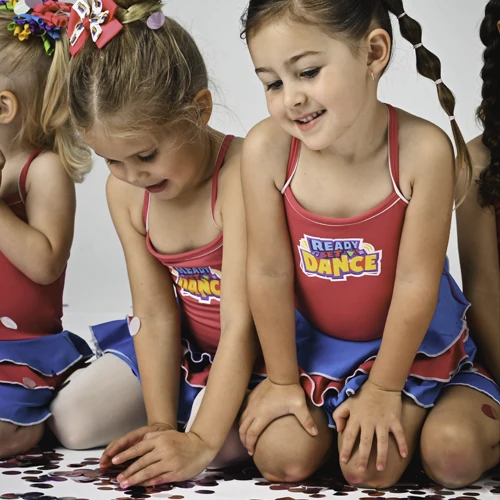 HDF Uniforms -Ready Set Dance students playing with confetti