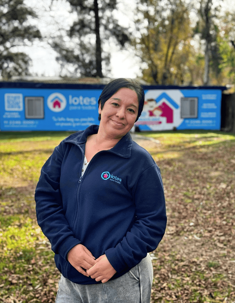 Close-up of a tree stump showing growth rings and a textured brown wood surface.