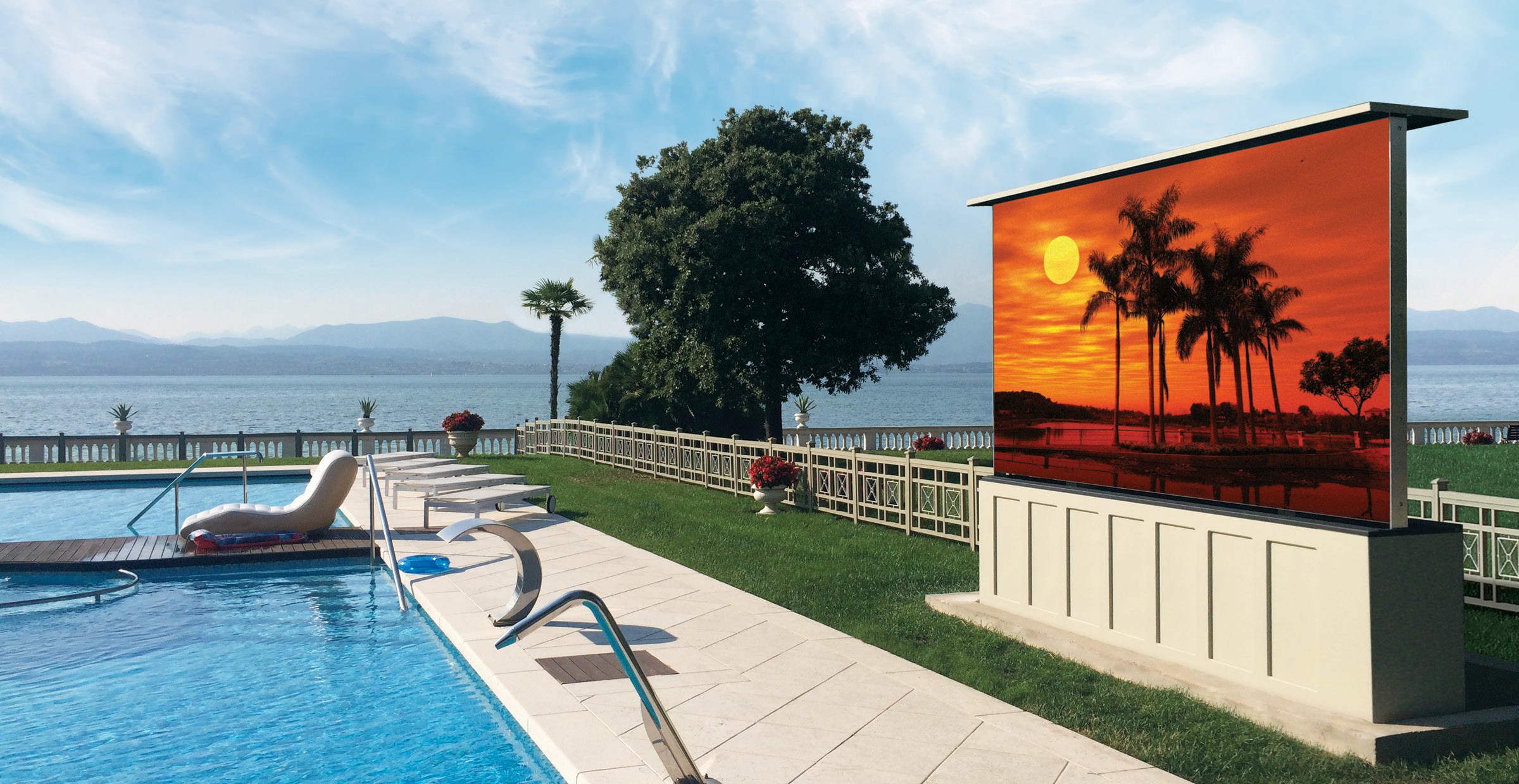 Outdoor screen with sunset palm tree image