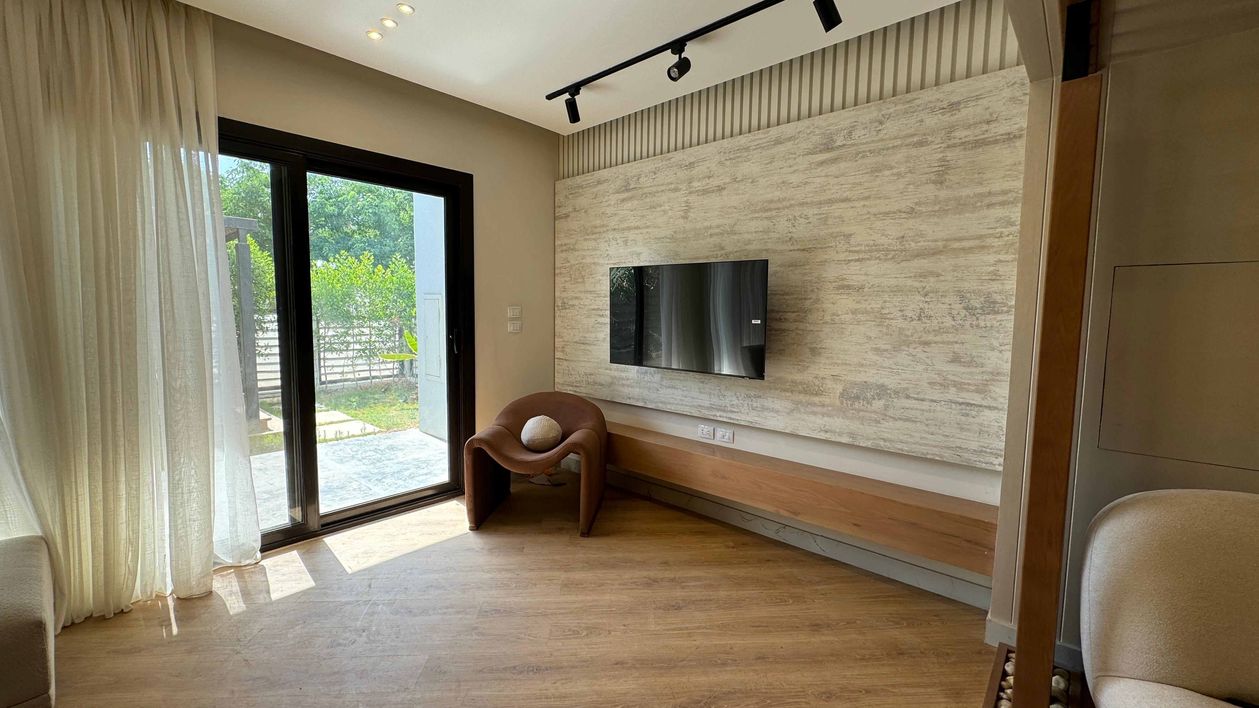 Background image featuring a modern interior design space for the testimonial Card