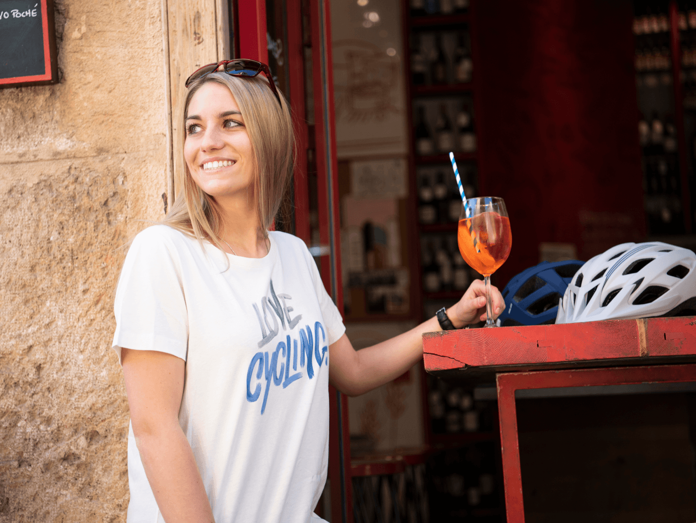 The woman is wearing a shirt with the inscription Love Cycling.