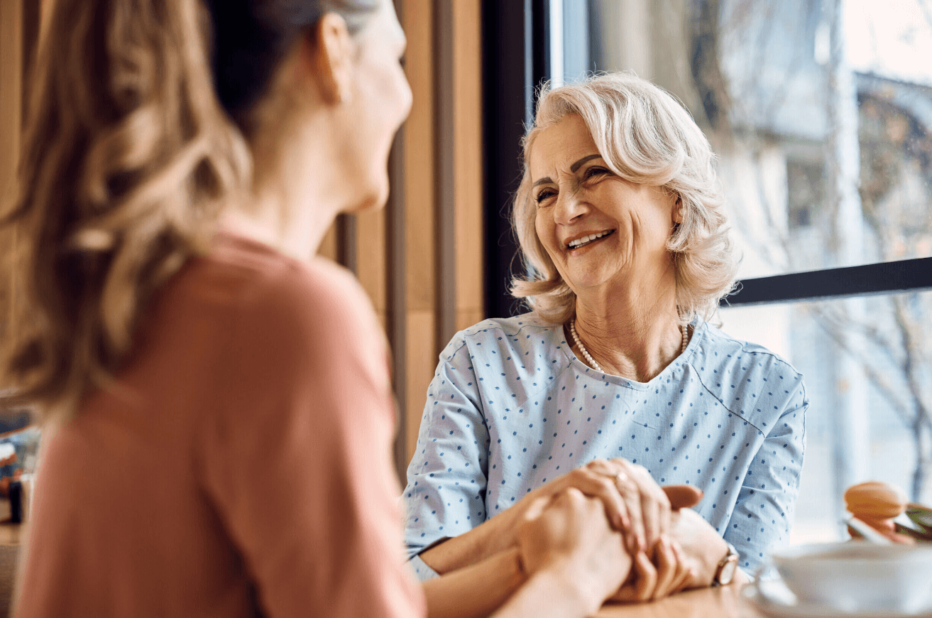 woman in pink and white stripe dress standing on road during daytime