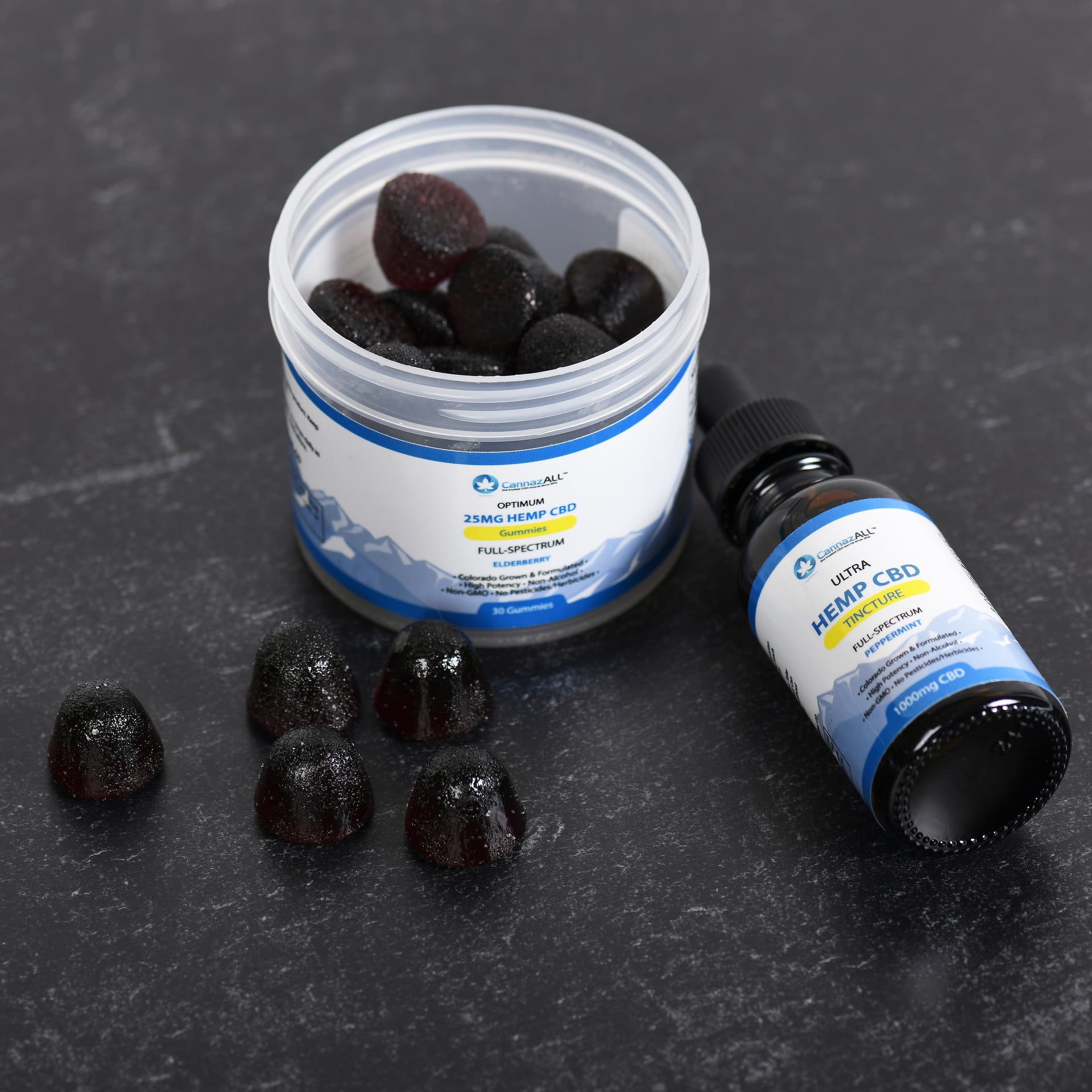 product photography of supplement jar and bottle on black marble background