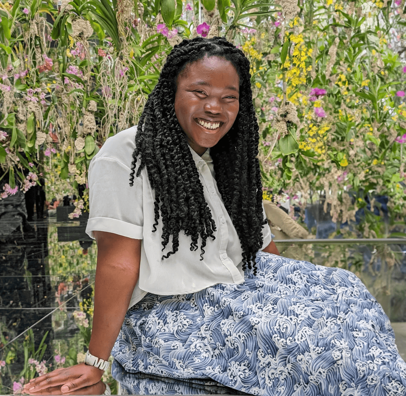 Bisola smiling and looking down with her eyes closed at TeamLabs Tokyo