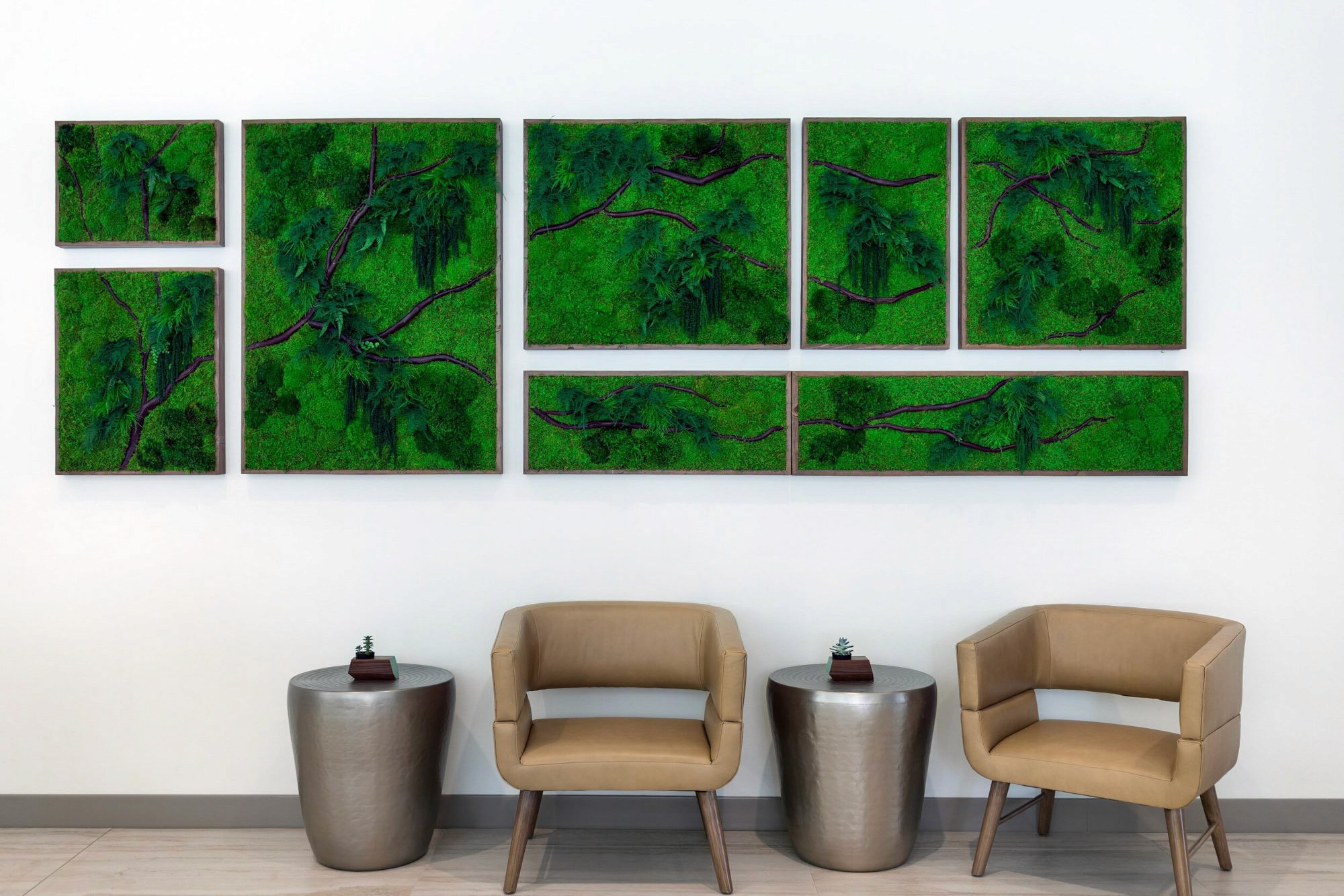 Modern seating arrangement near moss plant wall frame