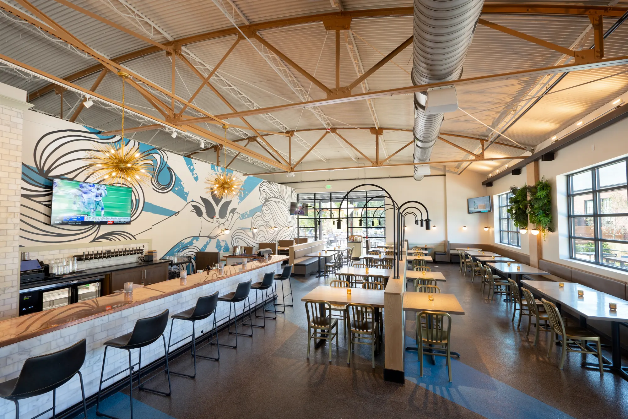 Dining room with long bar and mural at North High Westerville