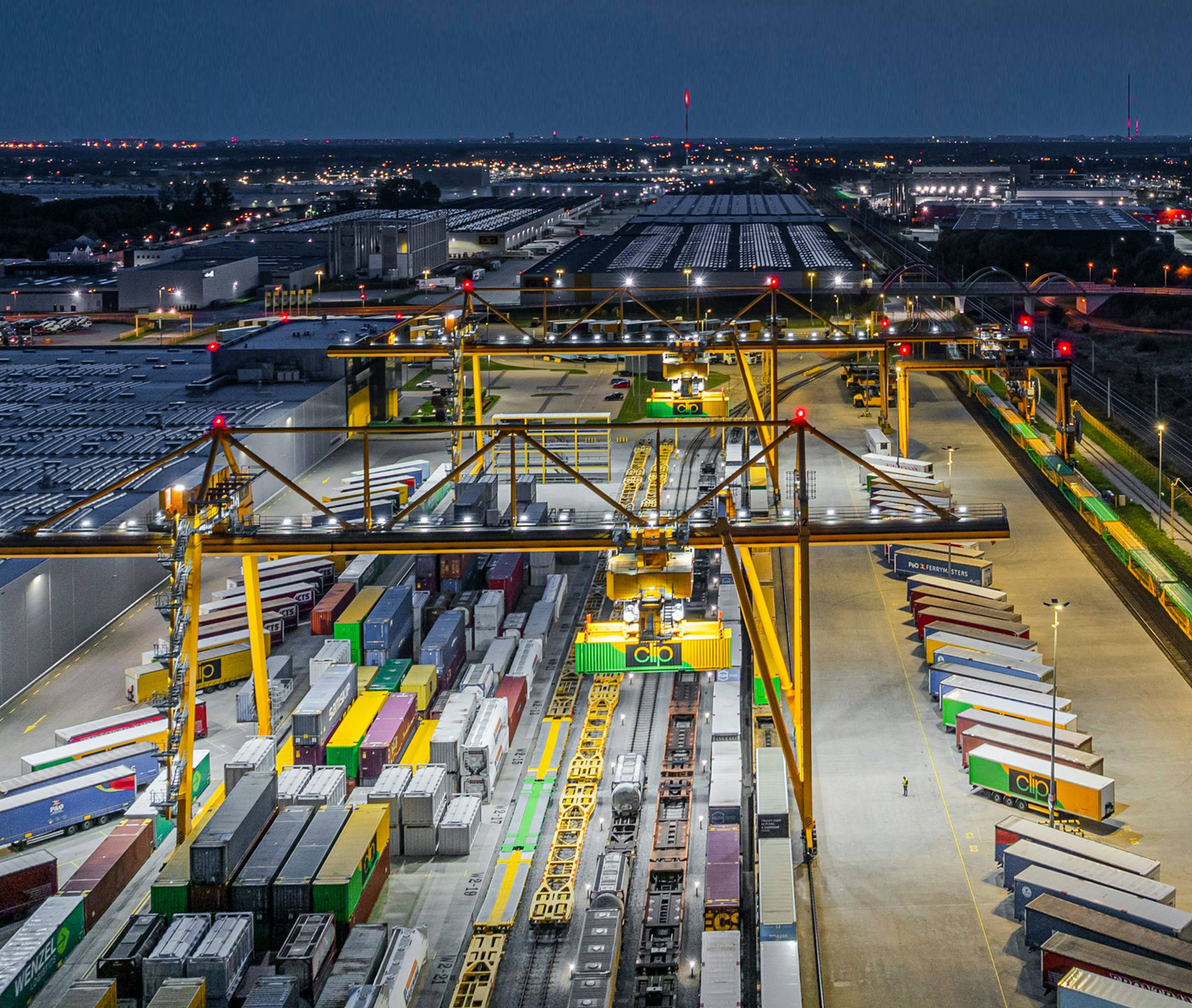 a large amount of cargo containers are stacked together