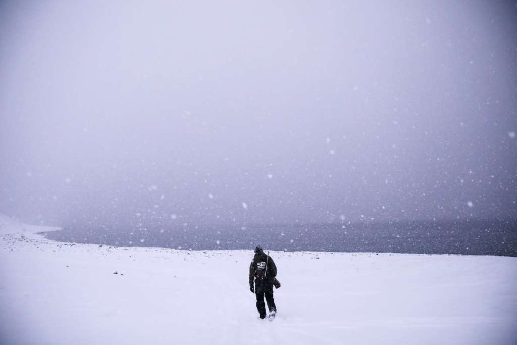Hiking through the snow in Svalbard