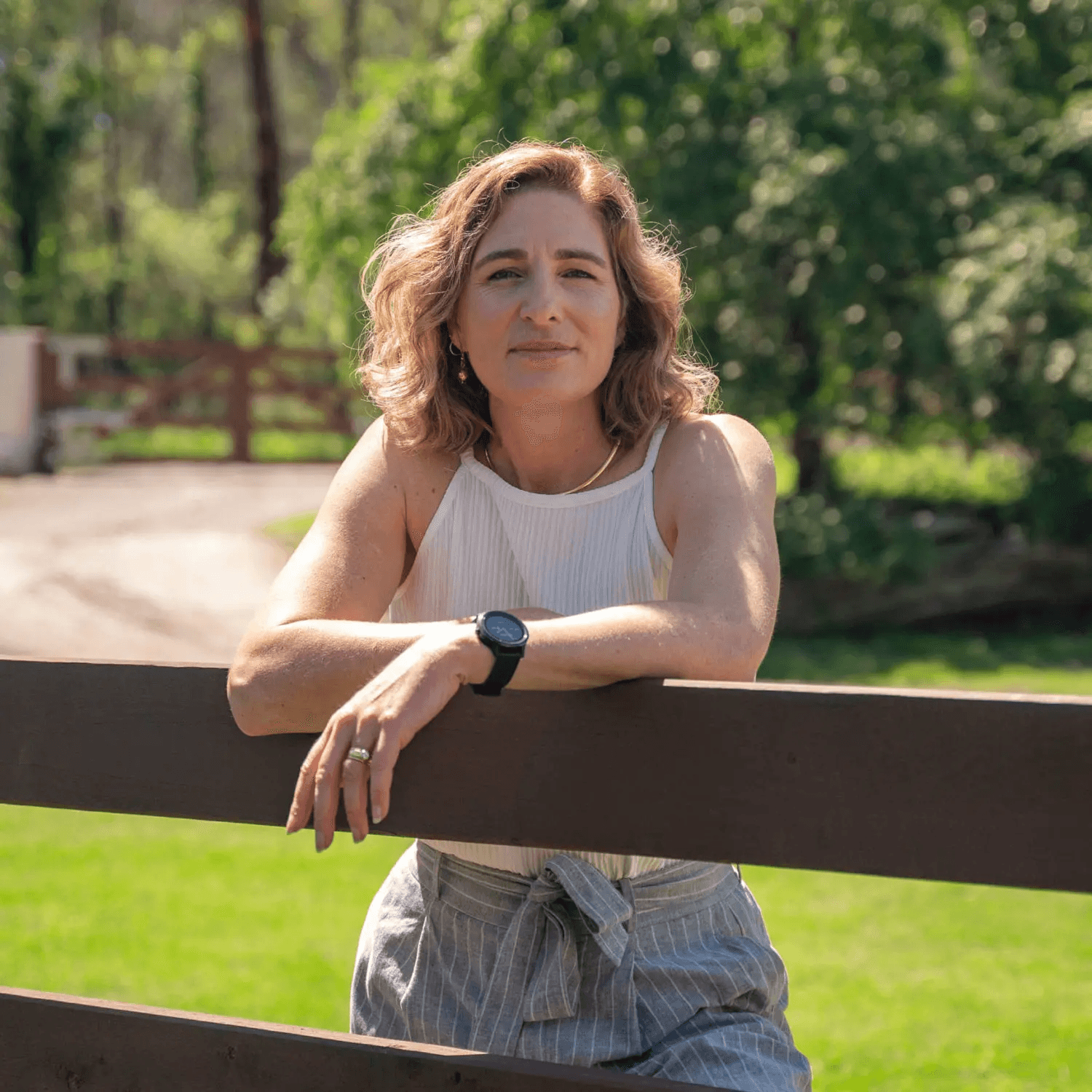 A fast black sports car races down the highway.