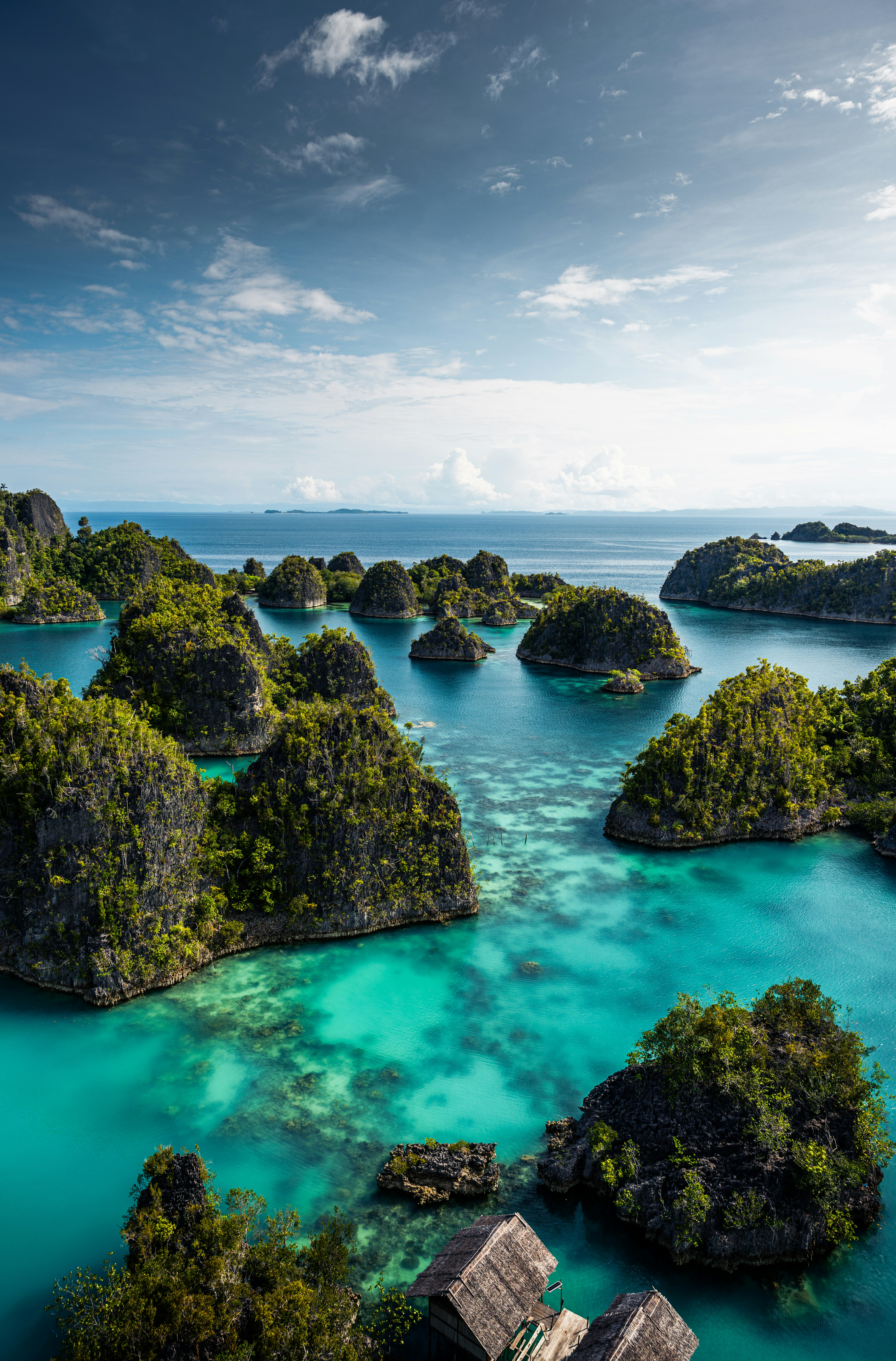 an aerial view of a lagoon with many small islands