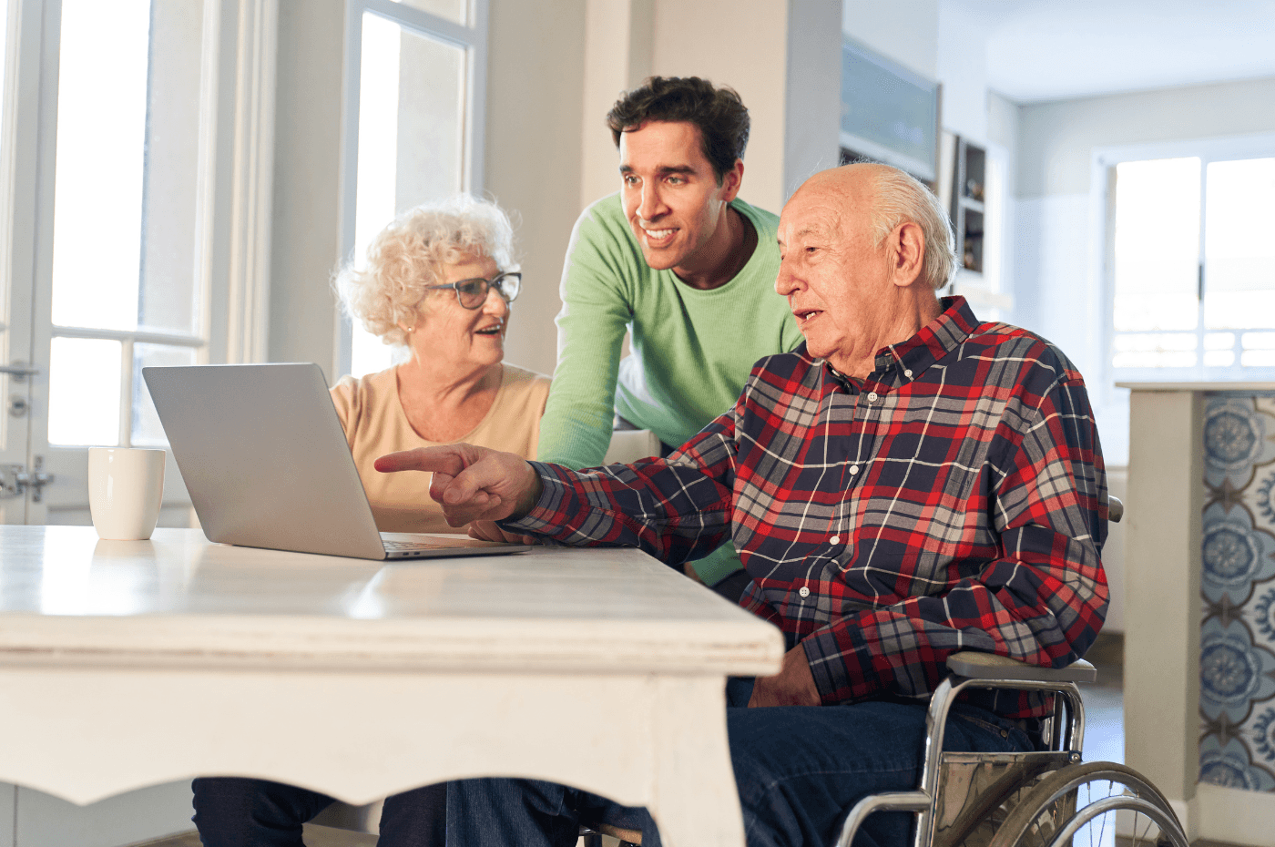 Son Helps Senior Parents at the Computer While Streaming Video