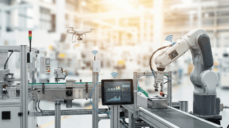 Industry 4.o image of robotics arm and laptop