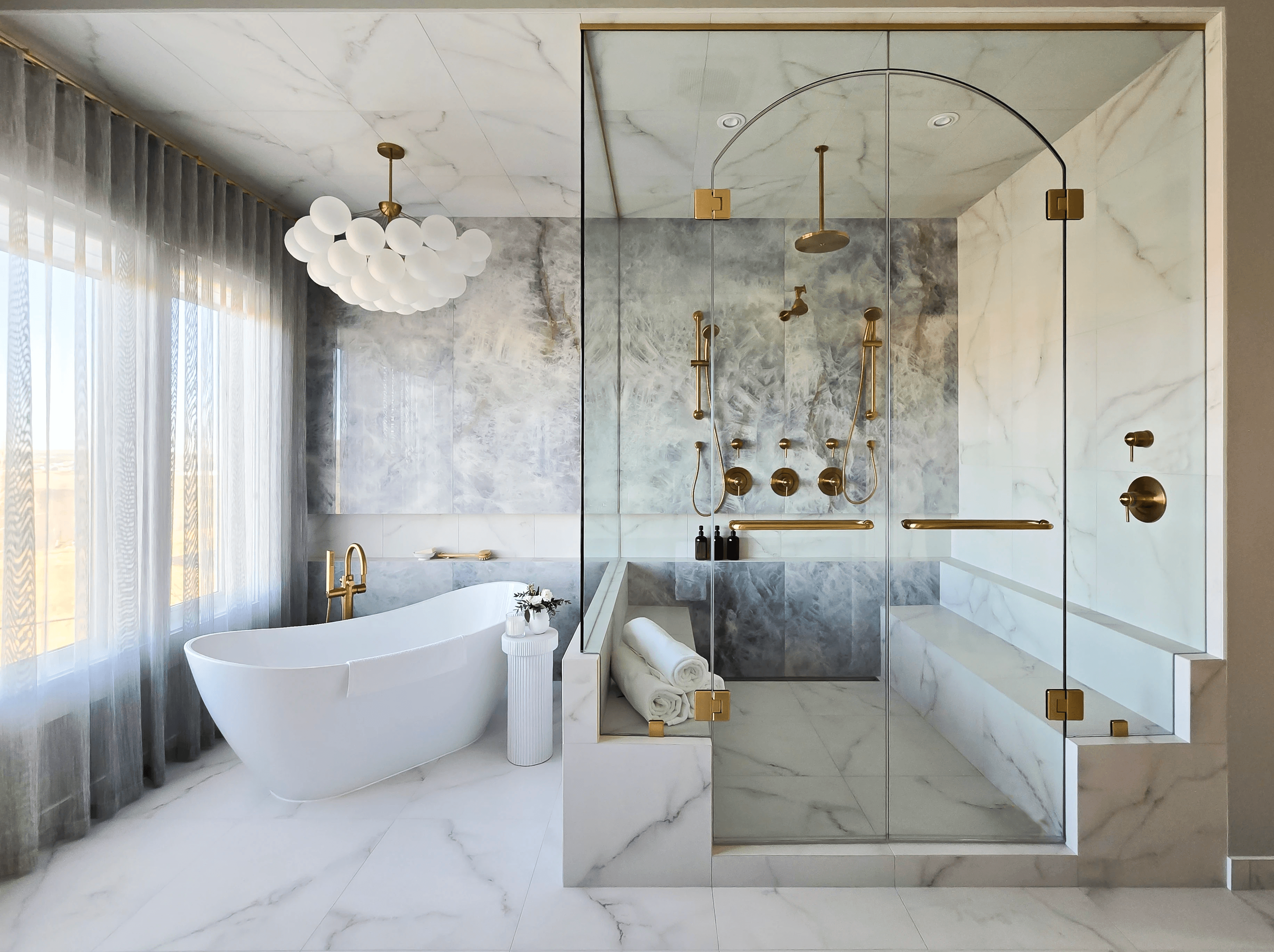Image of Luxury spa bathroom with freestanding tub, rainfall showerheads, and marble walls and floors, KHD Homes design.