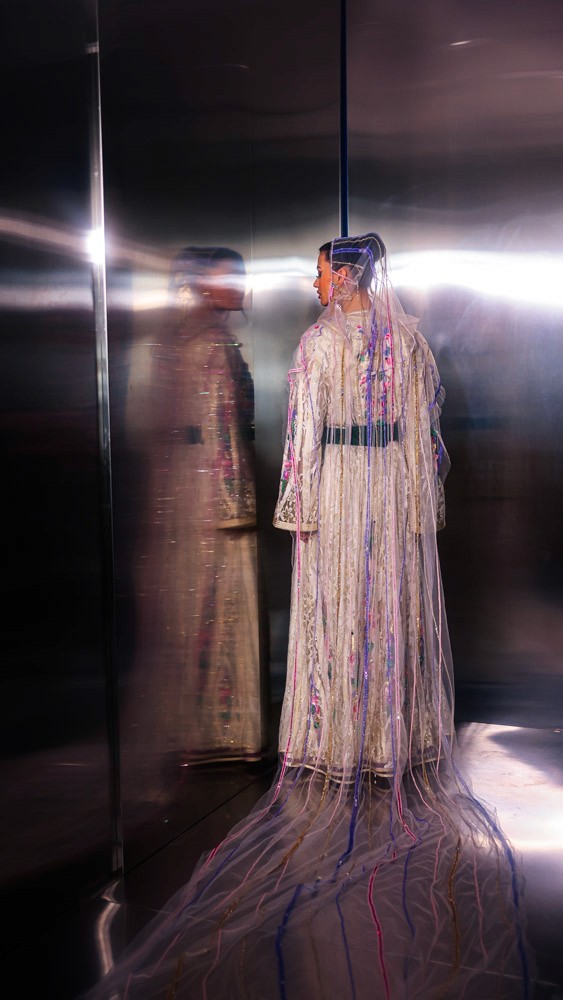 Ivory Moroccan caftan with colorful floral embroidery, handcrafted luxury piece for elegant events in Bahrain