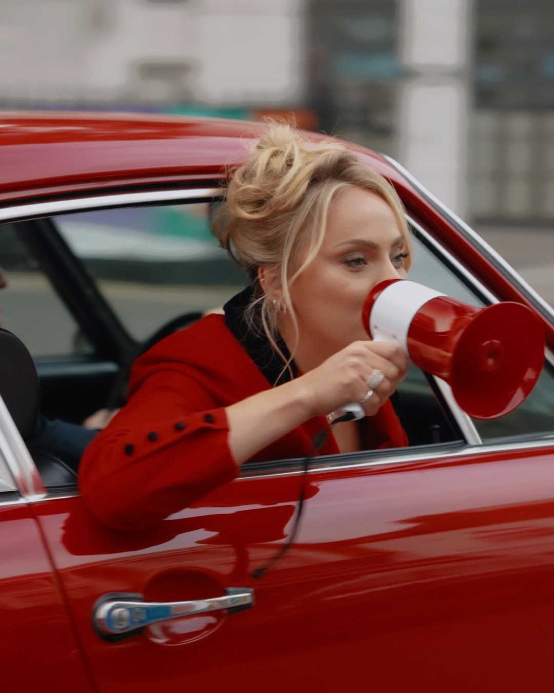 a blurry photo of a person standing in front of a wall