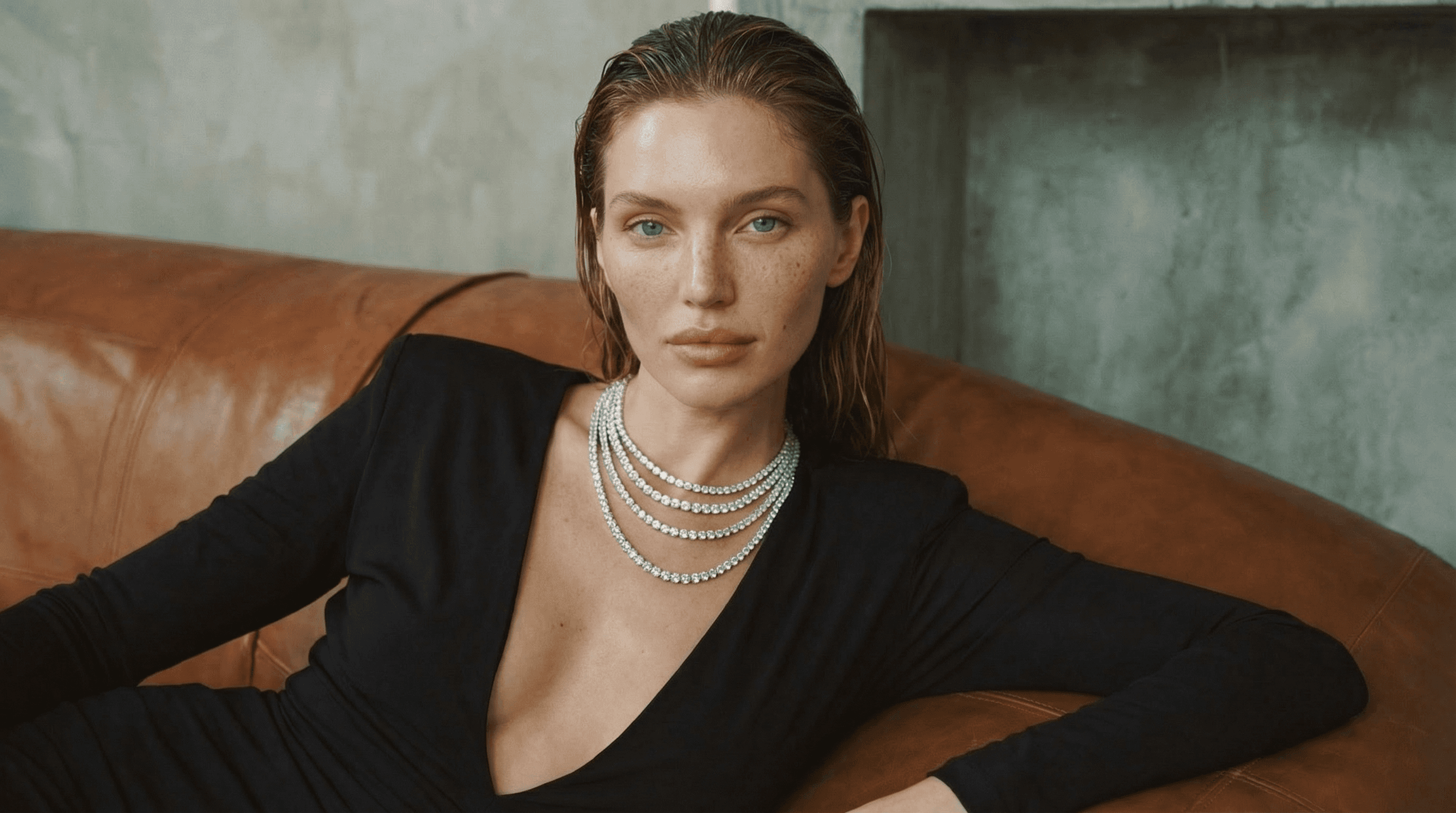 Slightly blurred image of a smart speaker with a glowing top, on a circular base.