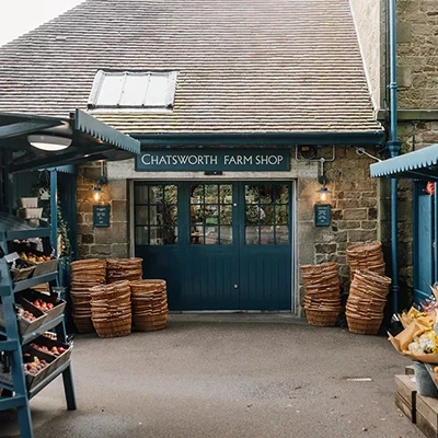 A view acroos the grass of chatsworth house the filming location of pride and prejudice farm shop