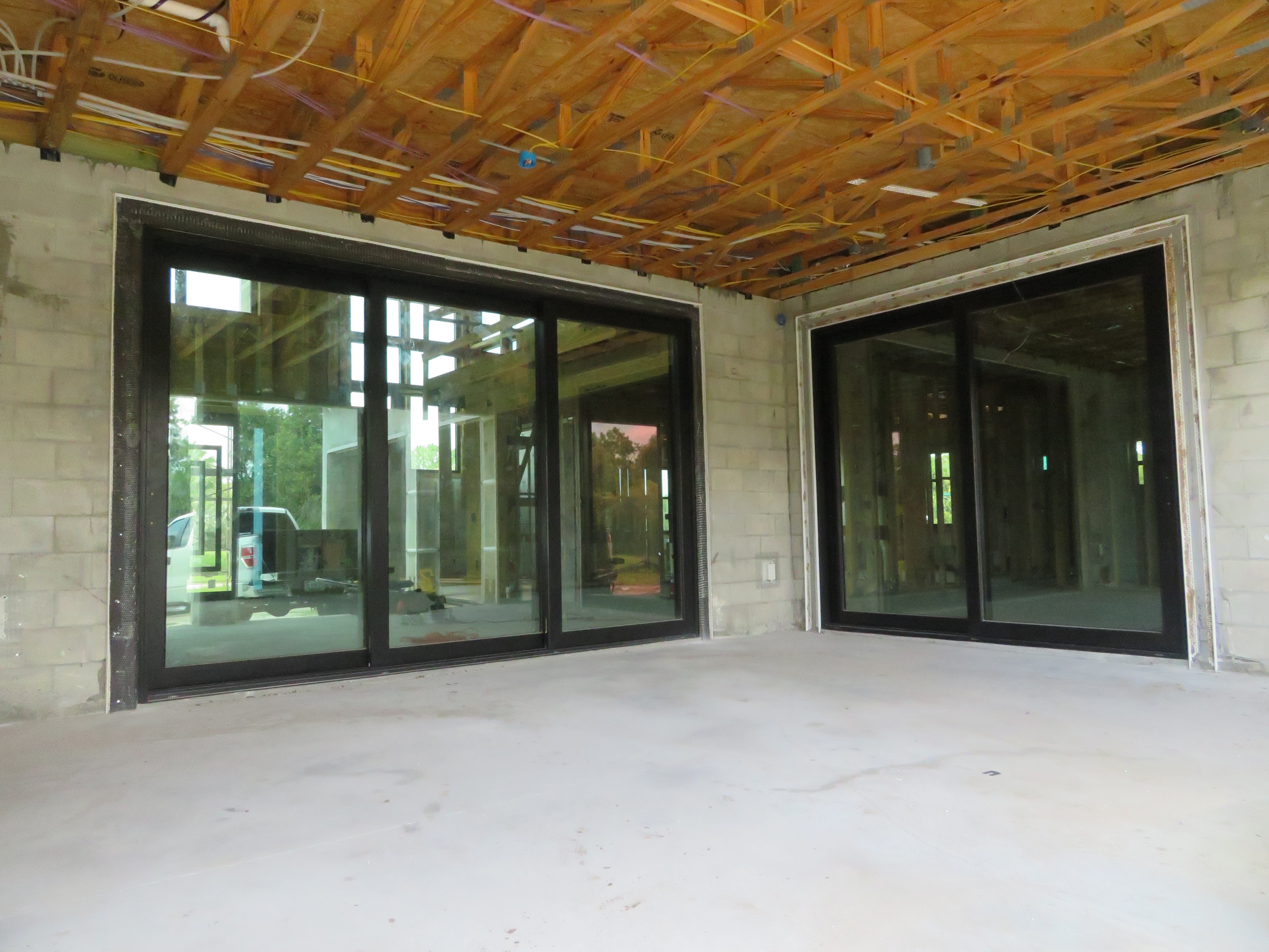 Large glass sliding doors on a new home construction patio