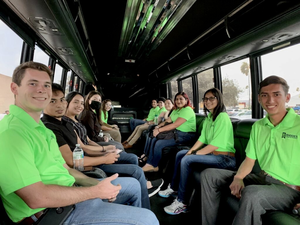 Rhodes summer interns in the bus