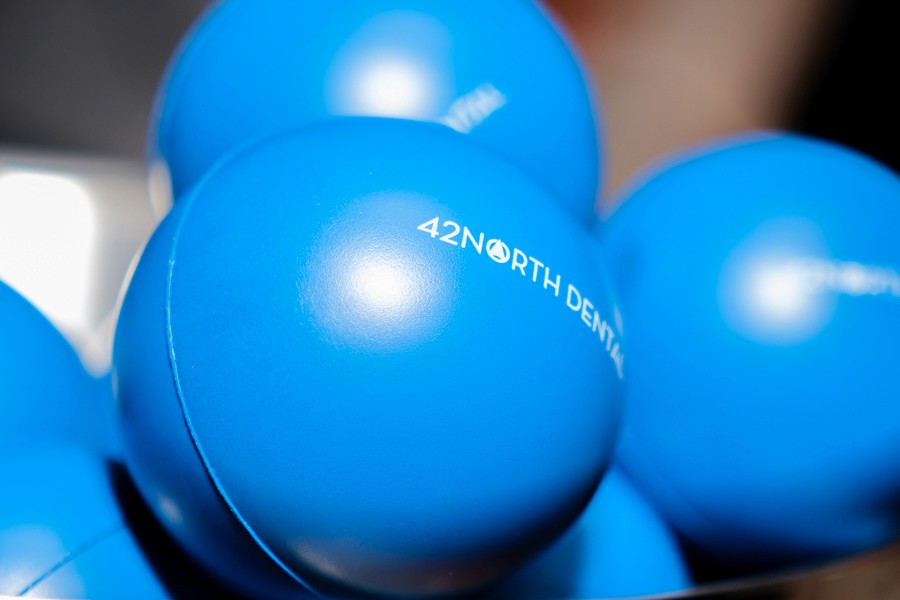 Blue branded balloons at a corporate event