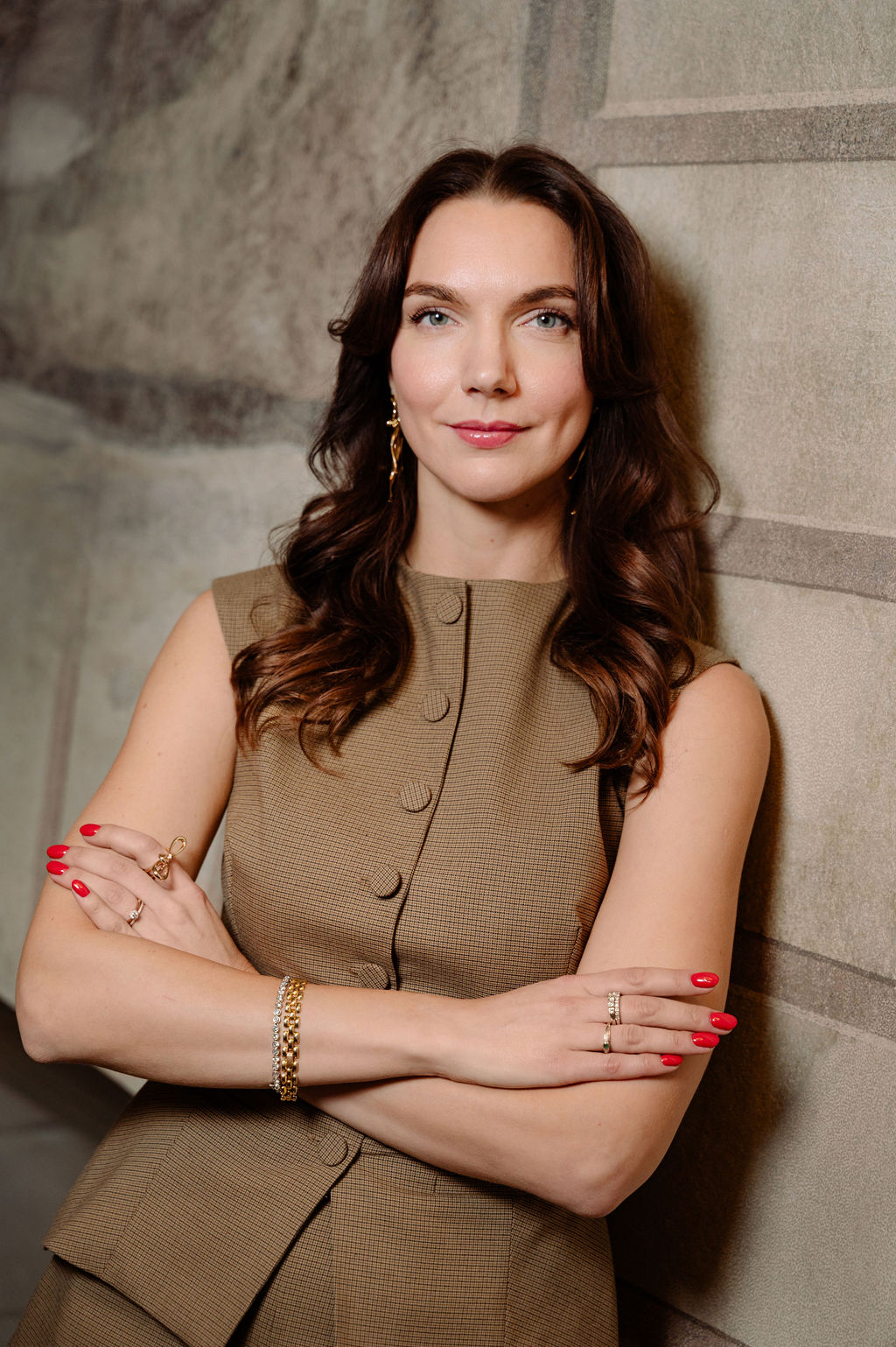 a woman standing with her arms crossed