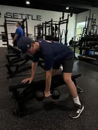 man in black hoodie standing