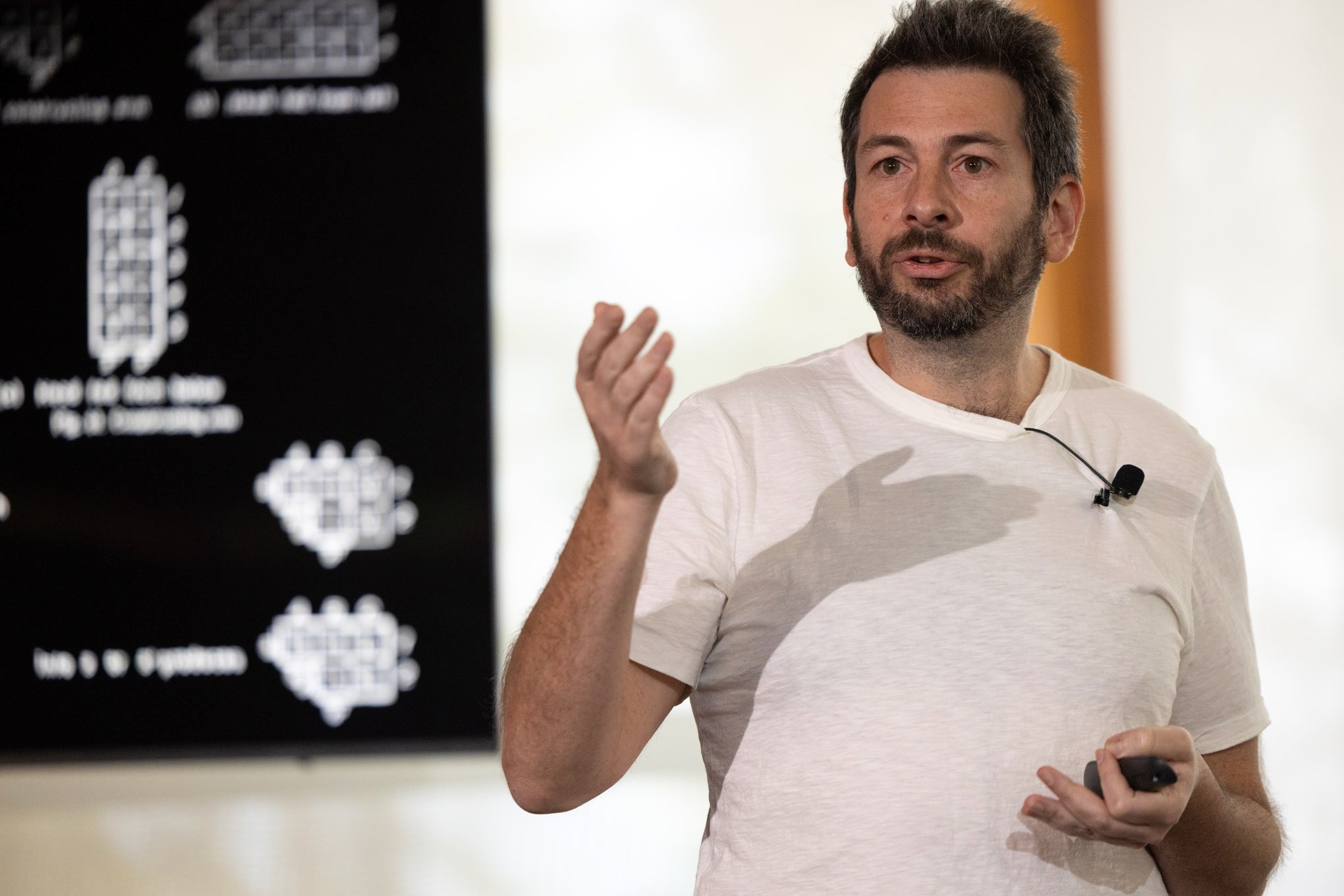 Blaise Agüera y Arcas delivering a keynote at the Artificiality Summit