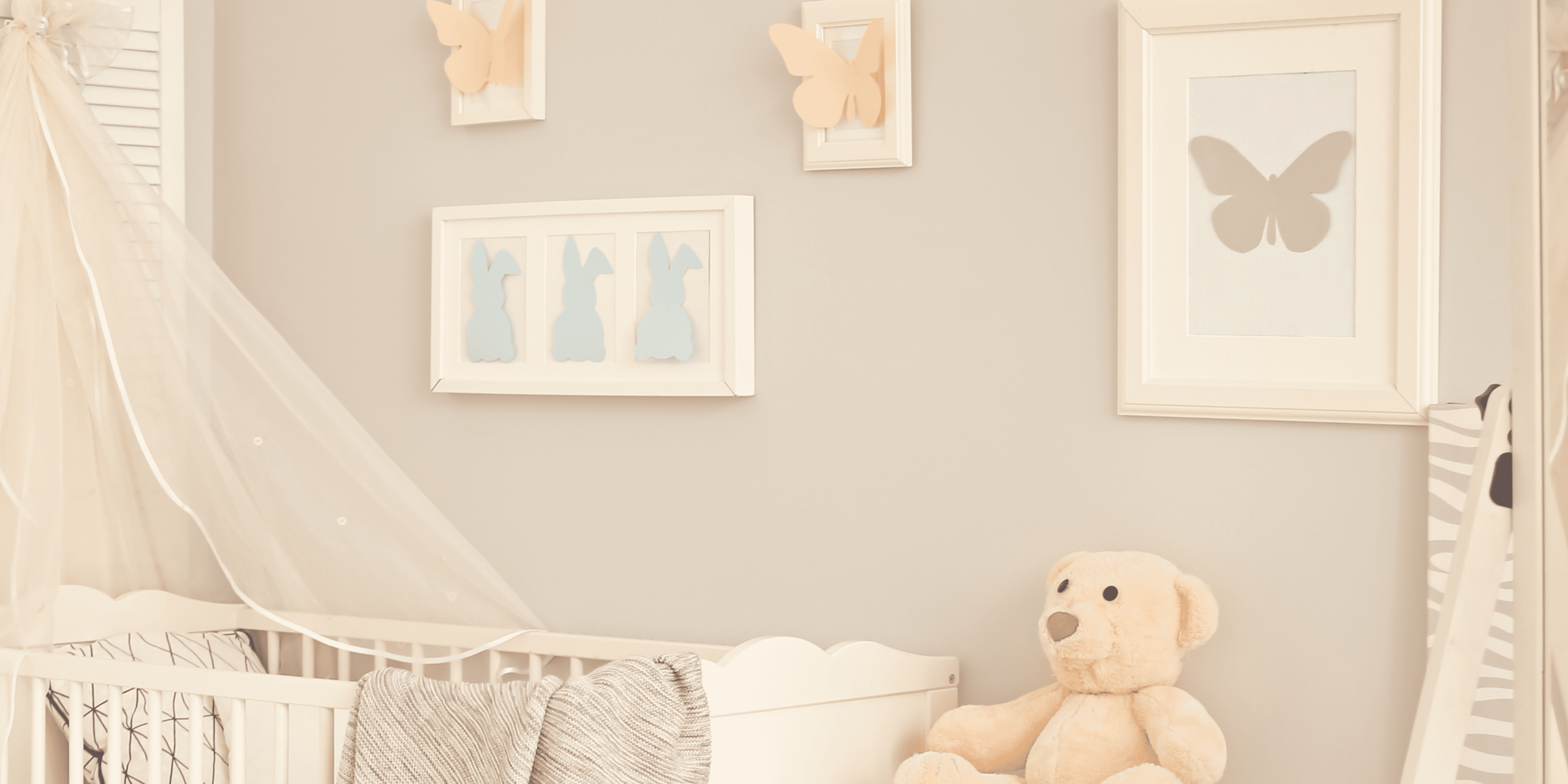 white sofa chair beside white window curtain