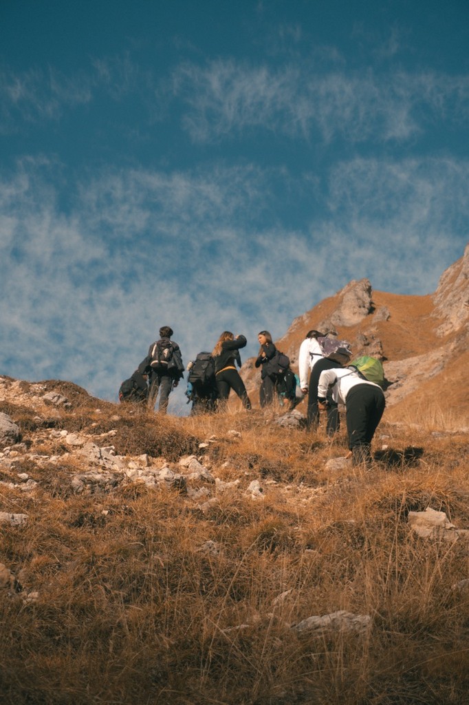Group of hikers climbing a mountain in the Dolomites